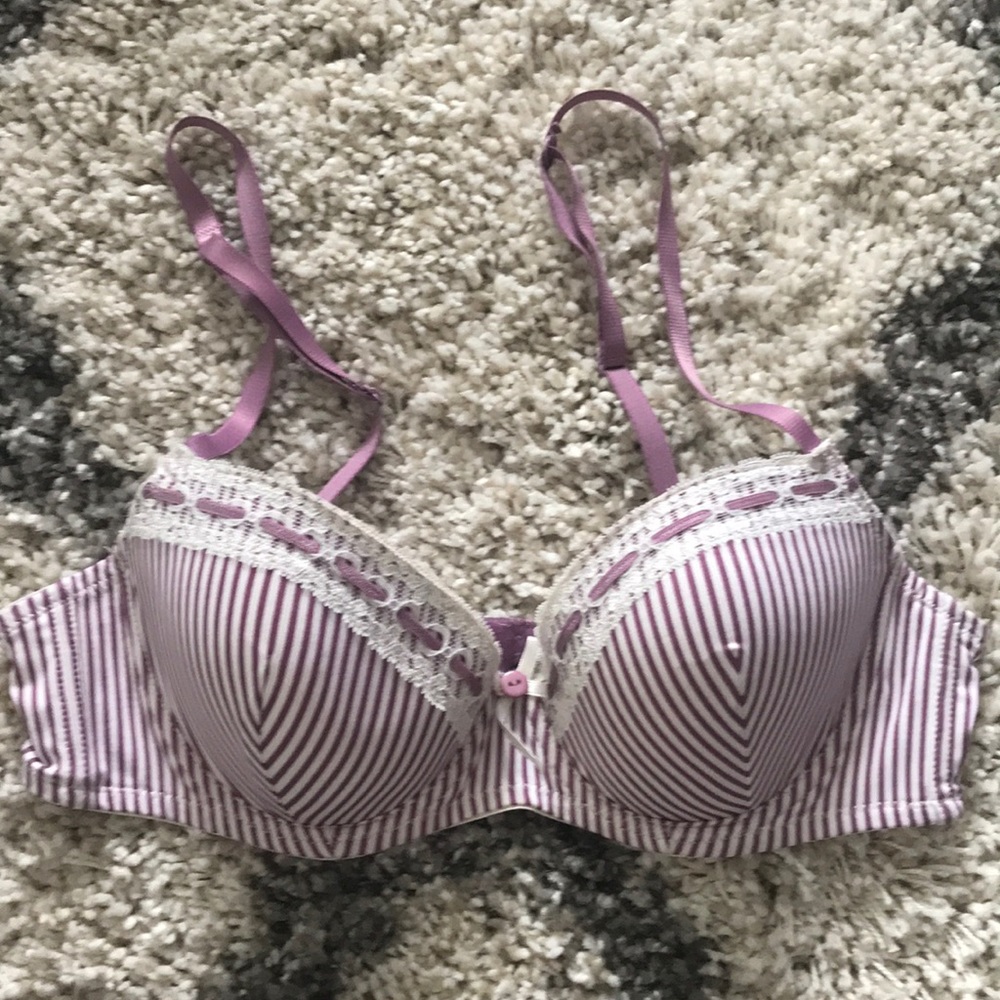 White bra with purple stripes and ribbon detail.